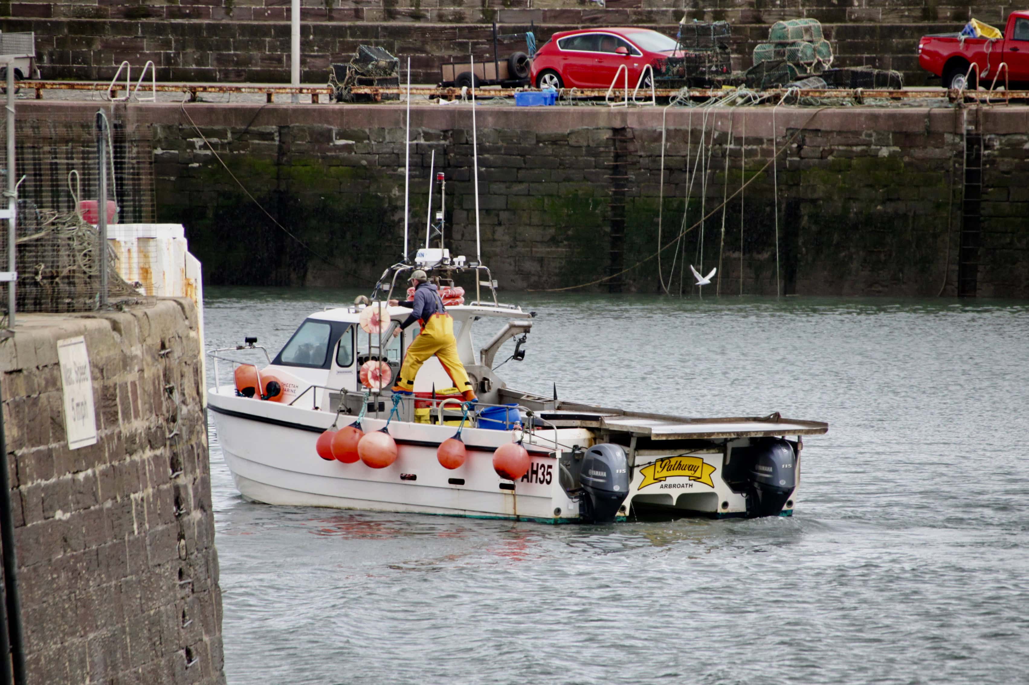 Fishing boat entering Arbroath inner harbour by Jez Braithwaite