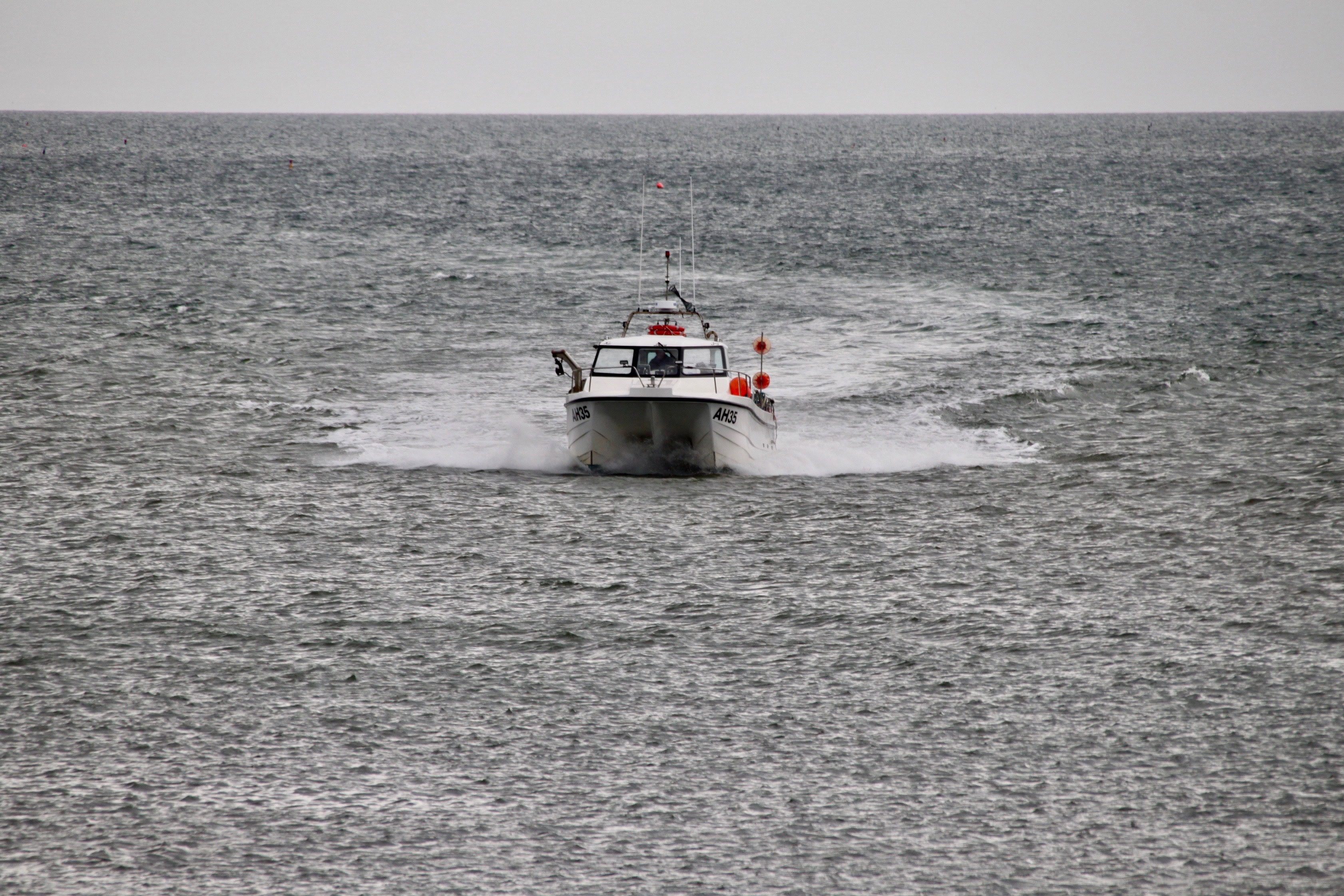 Fishing boat returning to Arbroath Harbour by Jez Braithwaite
