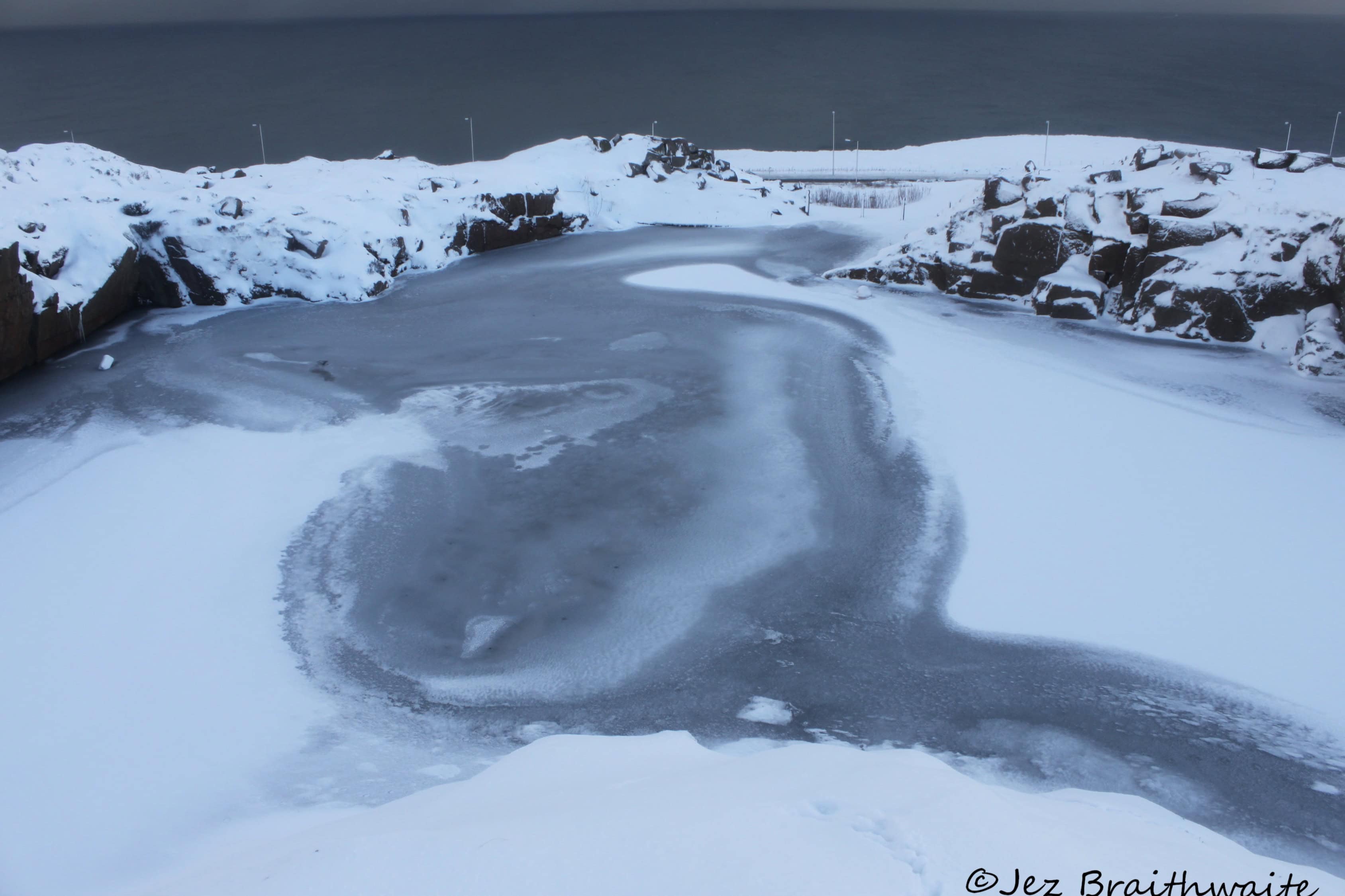 Frozen quarry pond
