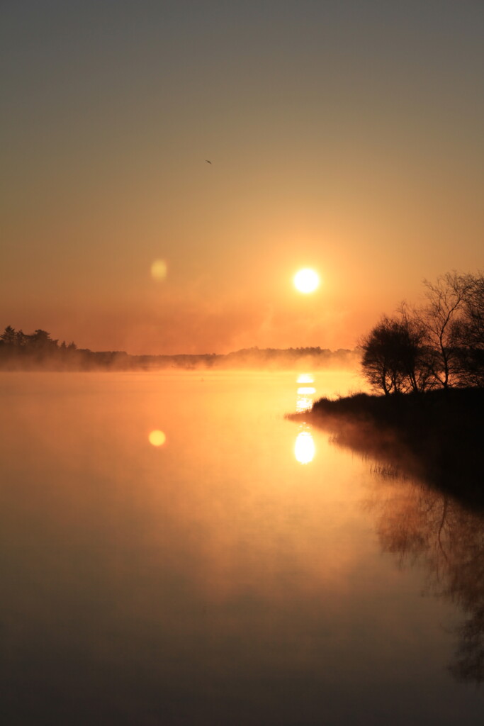 Reflected sunrise at Fannyside Lochs