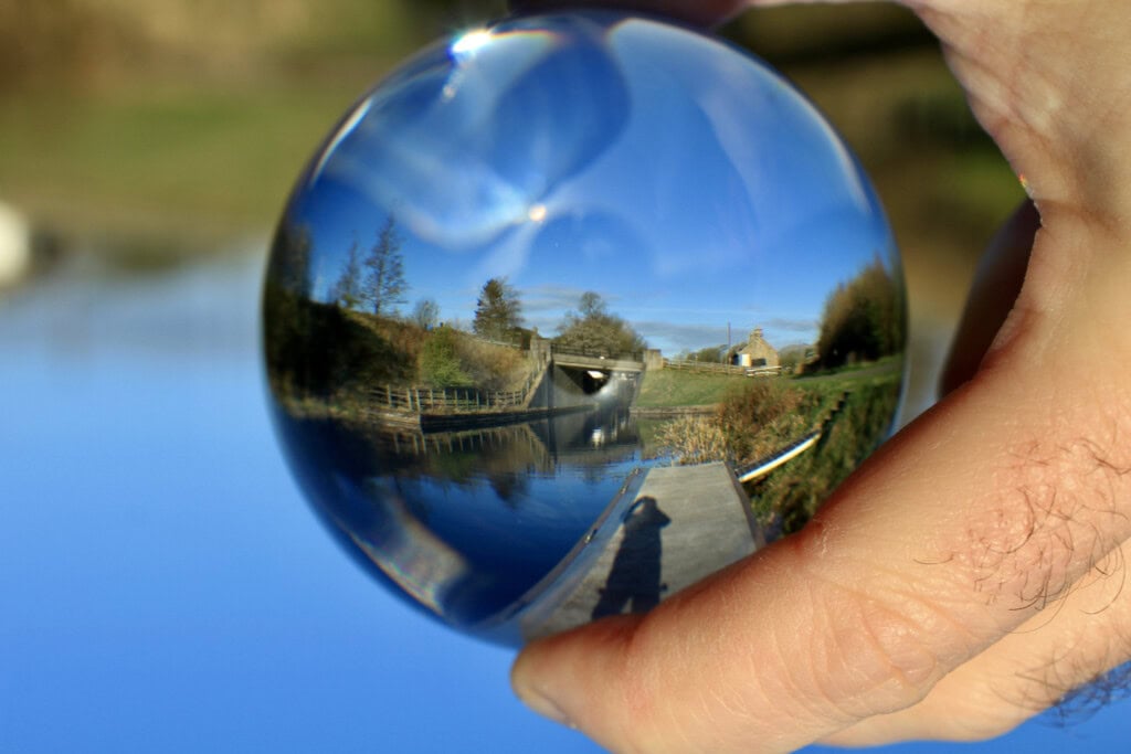 Canal bridge through a lensball