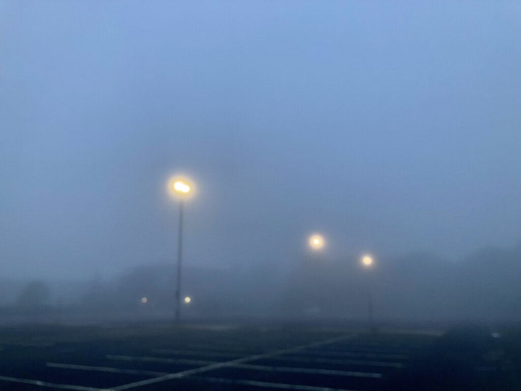 Three lights on a foggy morning